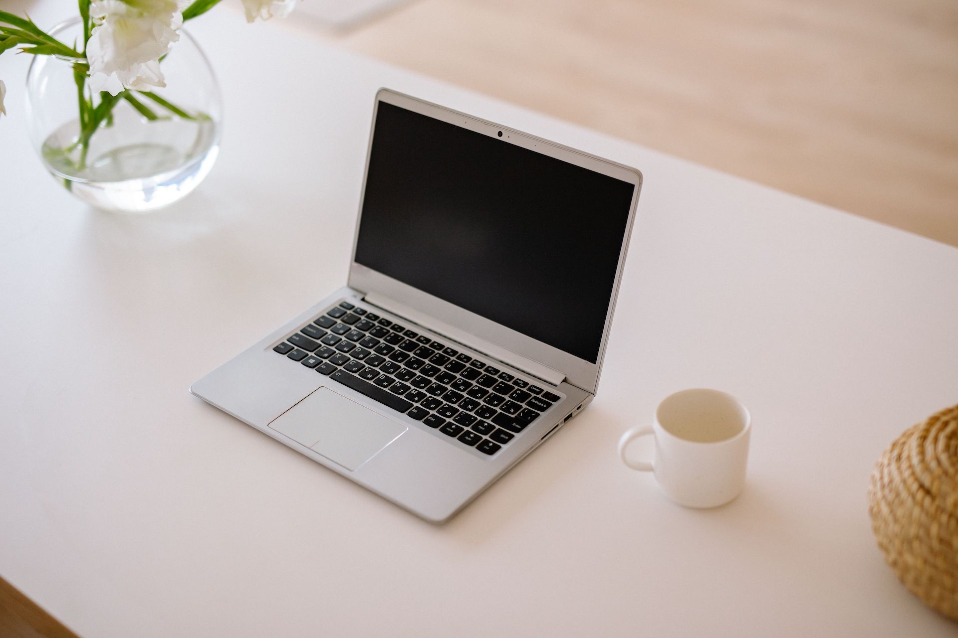 Laptop on a bright desk, web design by One Rank